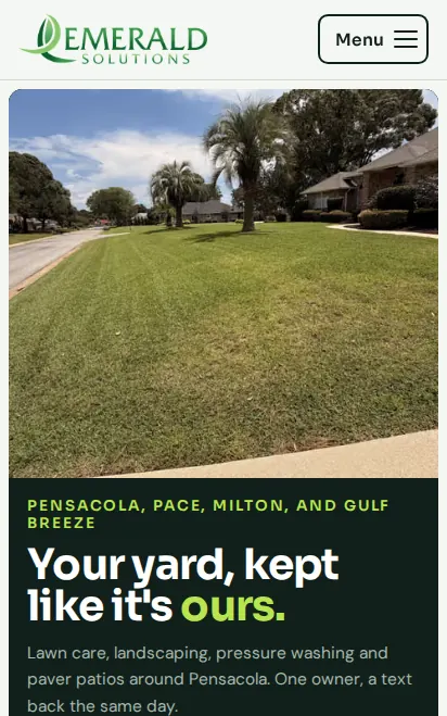 Emerald Solutions website on a phone: lawn care and landscaping in Pensacola